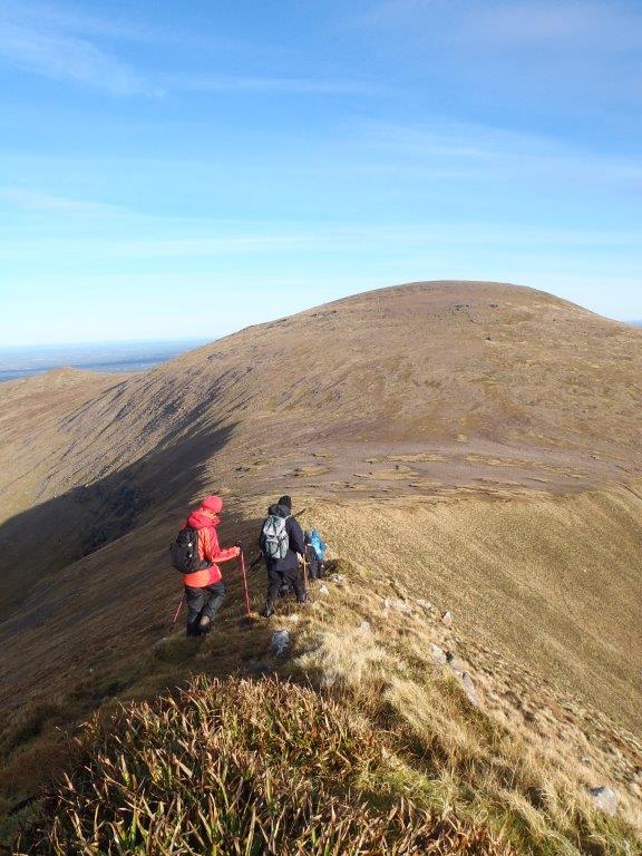 Hillwalkers on a mountain ridge